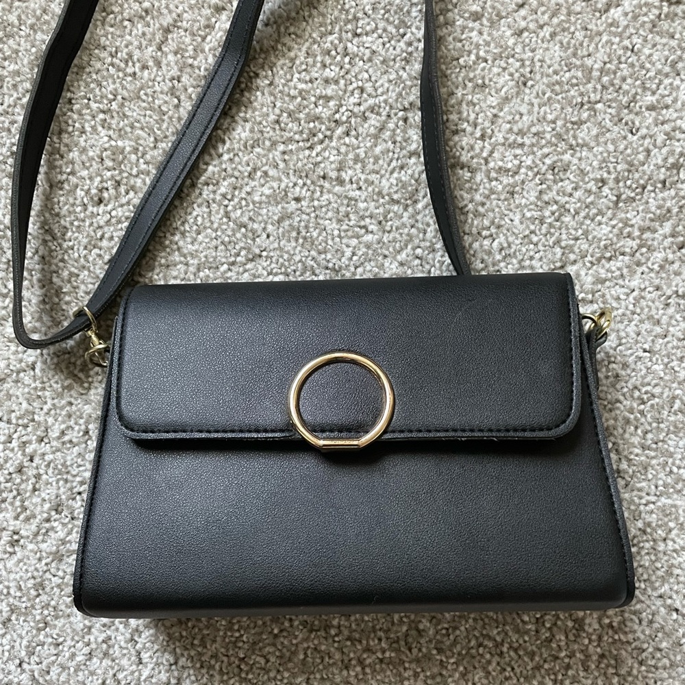 Black crossbody purse with gold hardware